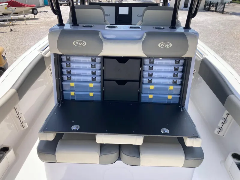 Slide: The Image of 2025 Key West 291FS boat with organized storage compartments and seating. - 9