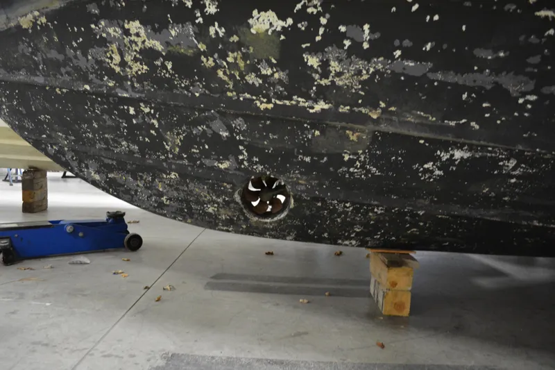 Slide: The Image of Bottom view of a 2001 Silverton 453 Motor Yacht hull in a workshop. - 10