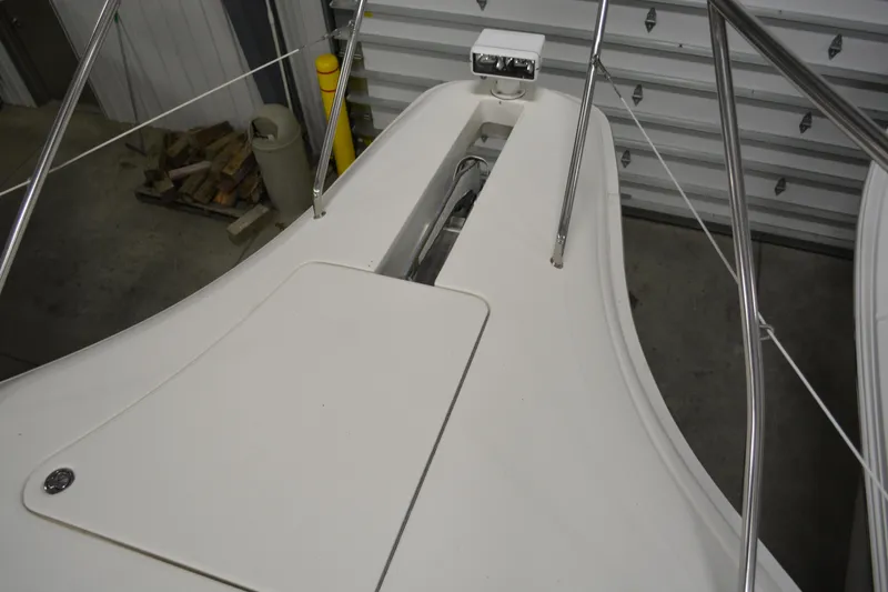 Slide: The Image of 2001 Silverton 453 Motor Yacht bow with anchor system in a storage facility. - 12