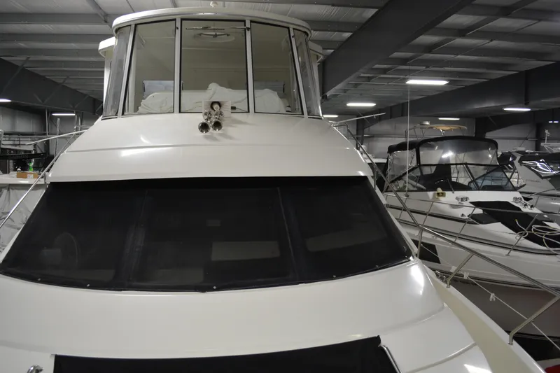 Slide: The Image of 2001 Silverton 453 Motor Yacht in indoor storage, front view. - 14