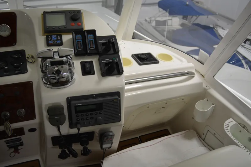 Slide: The Image of 2001 Silverton 453 Motor Yacht helm with navigation controls and instruments. - 19
