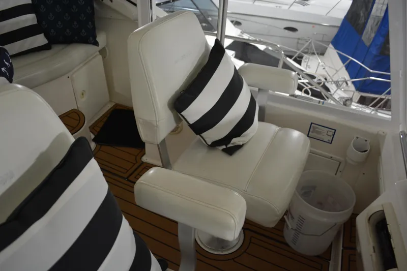 Slide: The Image of 2001 Silverton 453 Motor Yacht interior with striped cushions and white seating. - 20