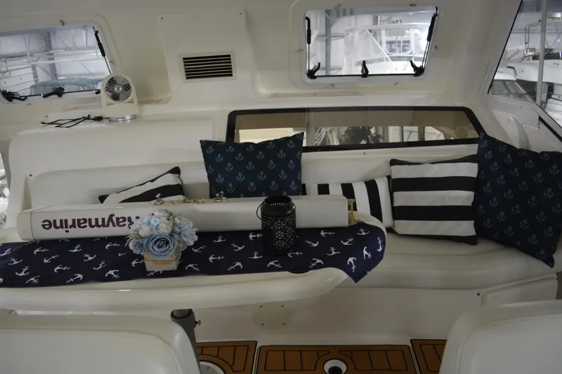 Slide: The Image of 2001 Silverton 453 Motor Yacht interior with nautical-themed cushions and decor. - 22