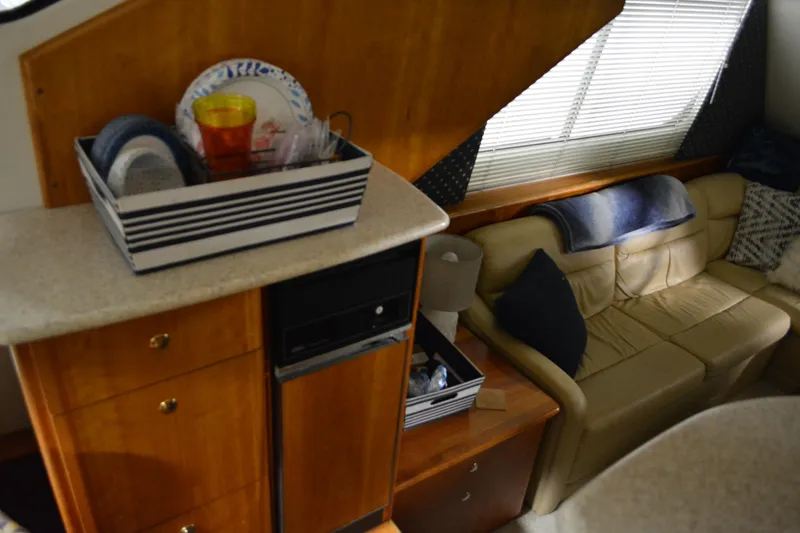 Slide: The Image of Interior of 2001 Silverton 453 Motor Yacht with cozy seating and storage. - 28