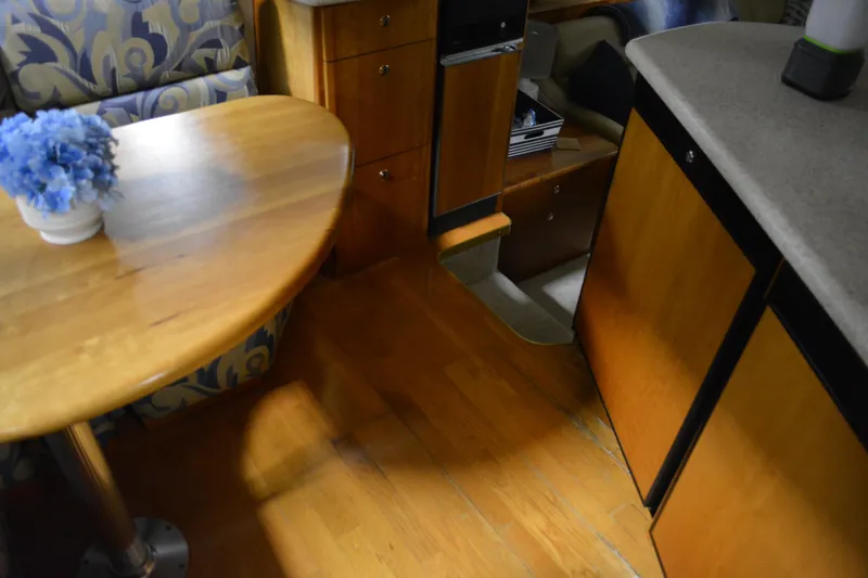 Slide: The Image of Interior of 2001 Silverton 453 Motor Yacht with wooden table and cabinetry. - 30