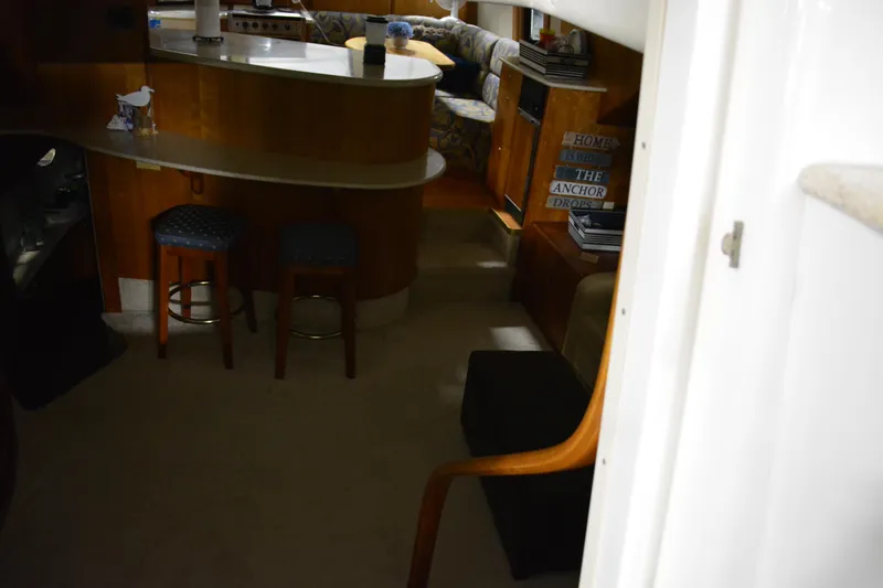 Slide: The Image of Interior of 2001 Silverton 453 Motor Yacht with seating and bar area. - 31