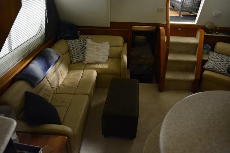 Slide: The Image of Interior of 2001 Silverton 453 Motor Yacht with cozy seating and stairs. - 33