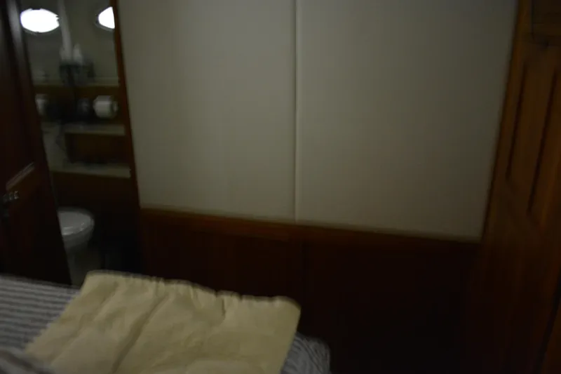 Slide: The Image of Interior cabin of 2001 Silverton 453 Motor Yacht with bed and bathroom view. - 43