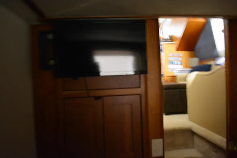 Slide: The Image of Interior view of 2001 Silverton 453 Motor Yacht with TV and seating area. - 47