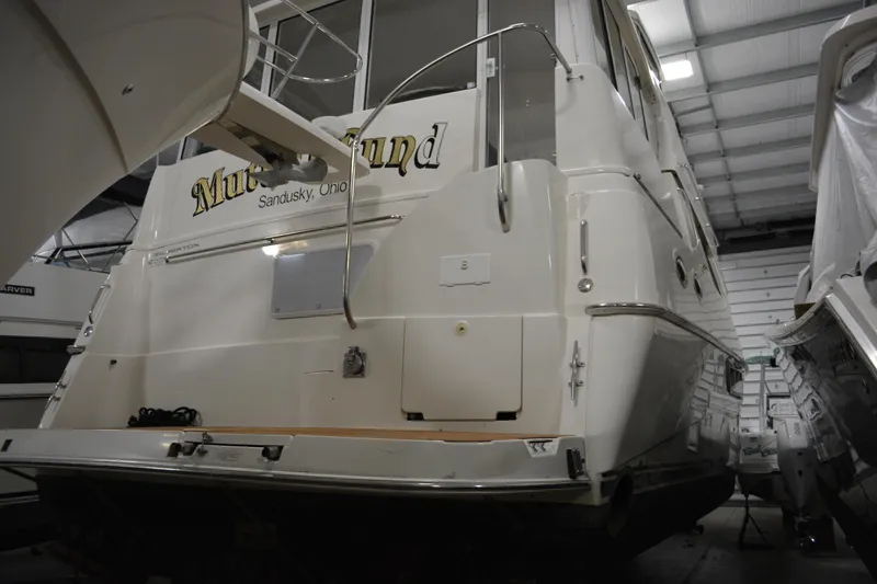 Slide: The Image of 2001 Silverton 453 Motor Yacht in indoor storage, rear view. - 6