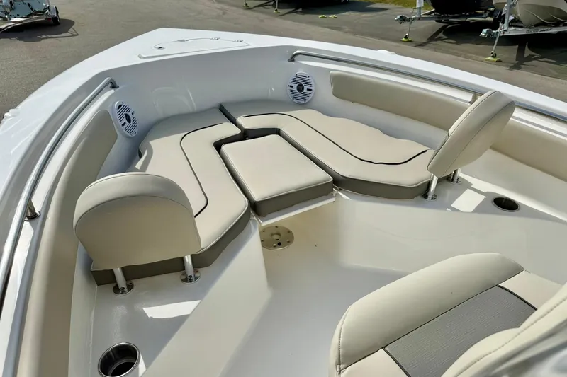 Slide: The Image of 2025 Key West 203 FS boat interior with cushioned seating and speakers. - 14