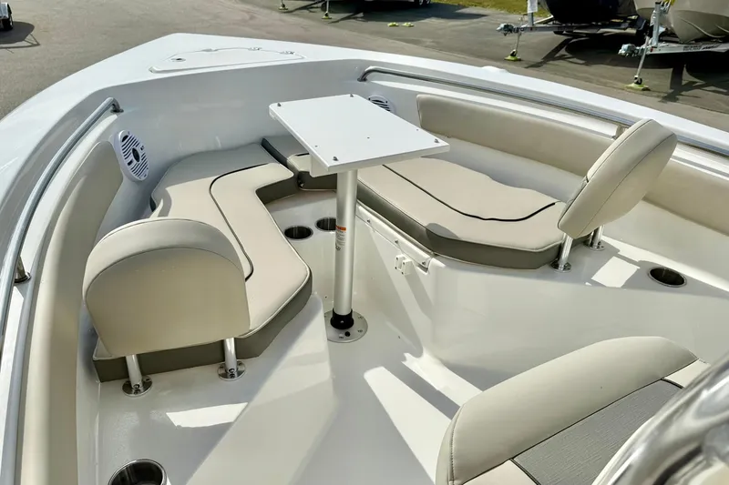 Slide: The Image of 2025 Key West 203 FS boat interior with cushioned seating and table. - 15