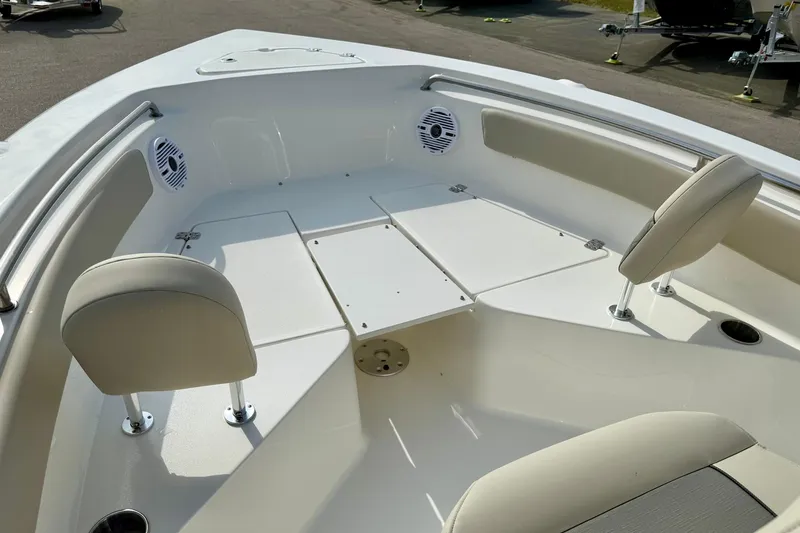Slide: The Image of 2025 Key West 203 FS boat interior with seating and storage compartments. - 16