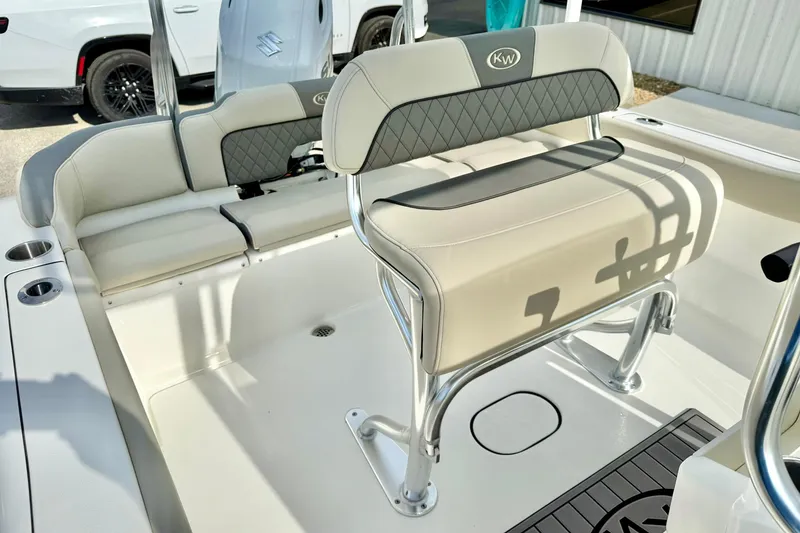 Slide: The Image of 2025 Key West 203 FS boat interior with cushioned seating and sleek design. - 25