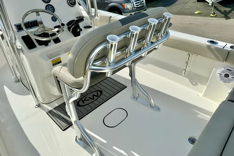Slide: The Image of 2025 Key West 203 FS boat interior with rod holders and steering console. - 28