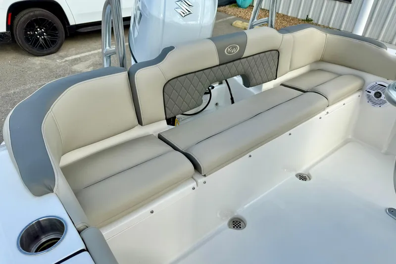 Slide: The Image of 2025 Key West 203 FS boat interior with cushioned seating and cup holder. - 29