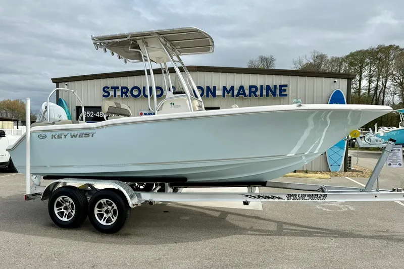 Slide: The Image of 2025 Key West 203 FS boat on trailer at Stroud & Son Marine dealership. - 4