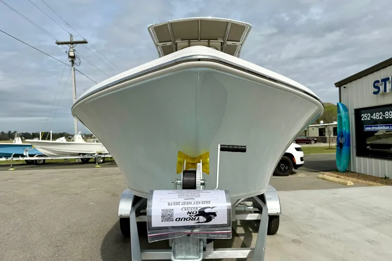 Slide: The Image of 2025 Key West 203 FS boat on trailer at dealership, front view. - 7