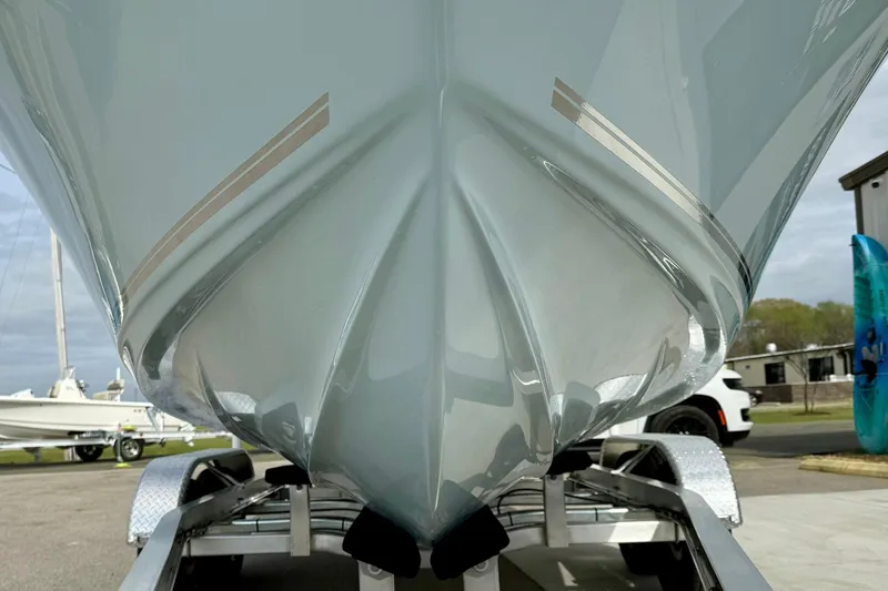 Slide: The Image of 2025 Key West 203 FS boat hull on trailer, showcasing sleek design and craftsmanship. - 8