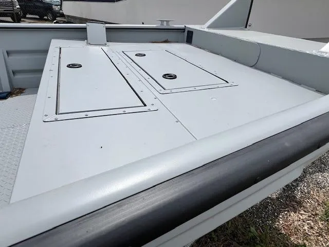 Slide: The Image of 2025 SeaArk 2672 Workhorse boat deck with storage compartments. - 2