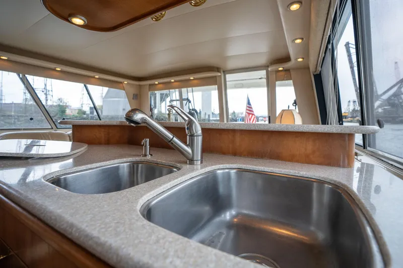 Slide: The Image of 2003 Meridian 490 Pilothouse kitchen with dual sinks and modern fixtures. - 13