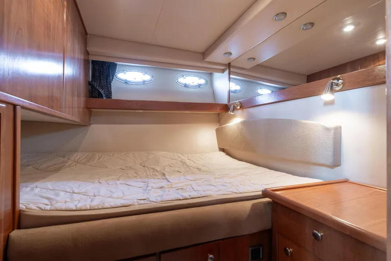 Slide: The Image of Cozy cabin interior of 2003 Meridian 490 Pilothouse with bed and wooden furnishings. - 17