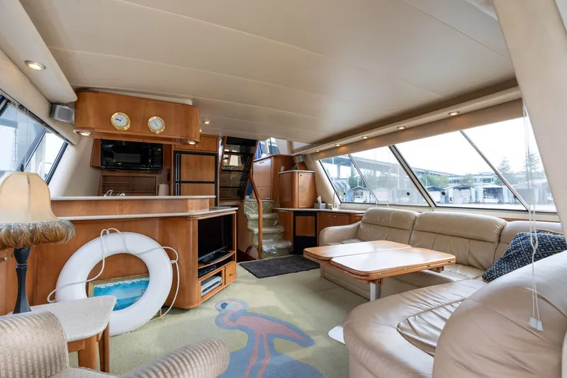 Slide: The Image of Luxurious interior of 2003 Meridian 490 Pilothouse yacht with plush seating and elegant decor. - 2