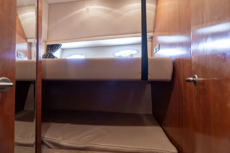 Slide: The Image of Interior of 2003 Meridian 490 Pilothouse with cozy bunk beds and wooden paneling. - 22