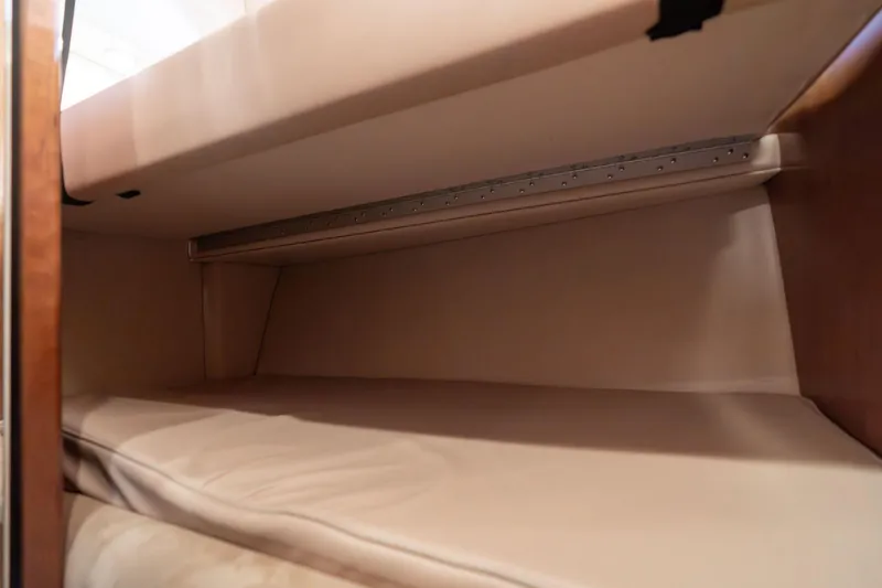 Slide: The Image of Interior cabin of 2003 Meridian 490 Pilothouse yacht, featuring beige upholstery. - 24