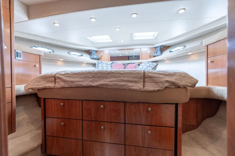 Slide: The Image of Luxurious bedroom interior of 2003 Meridian 490 Pilothouse yacht with wood cabinetry. - 27