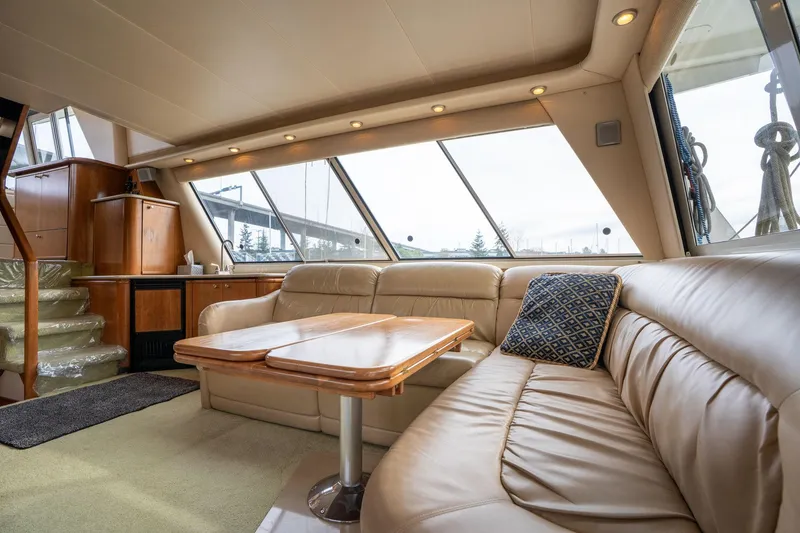 Slide: The Image of Luxurious interior of 2003 Meridian 490 Pilothouse yacht with leather seating and panoramic windows. - 3