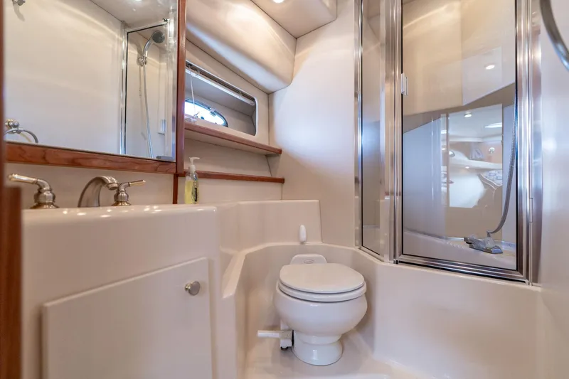 Slide: The Image of Luxurious bathroom in 2003 Meridian 490 Pilothouse yacht with shower and toilet. - 32