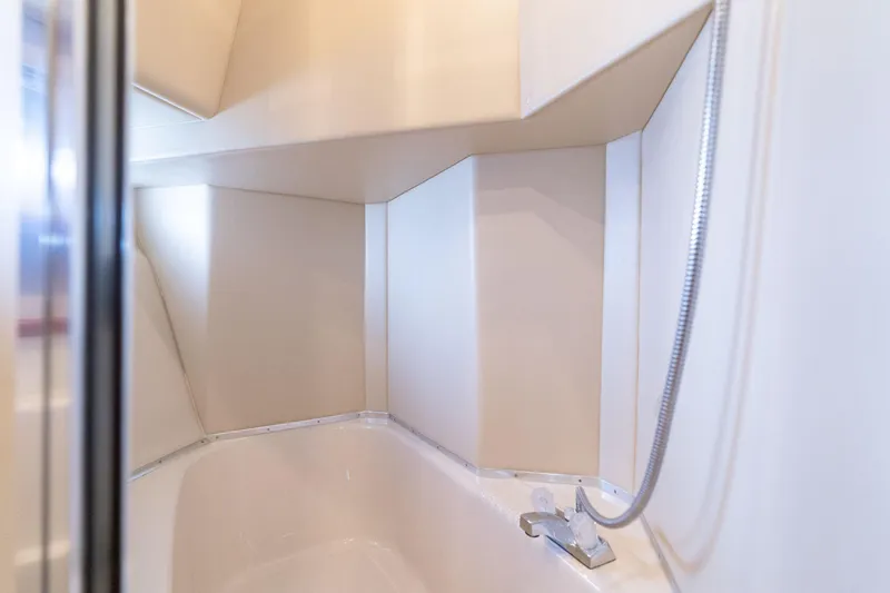 Slide: The Image of Interior of 2003 Meridian 490 Pilothouse bathroom with modern shower fixtures. - 34