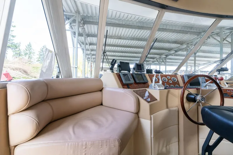 Slide: The Image of Luxurious 2003 Meridian 490 Pilothouse interior with leather seating and advanced navigation controls. - 39