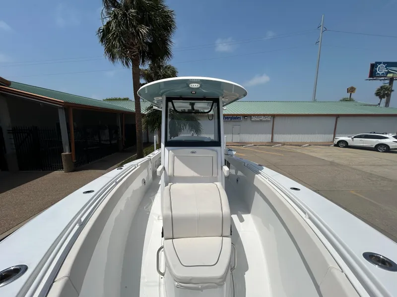 Slide: The Image of 2025 Sea Hunt Gamefish 27 with Coffin Box, docked under clear skies. - 17