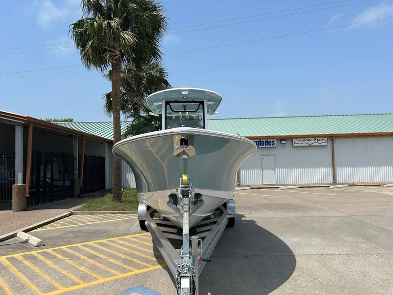 Slide: The Image of 2025 Sea Hunt Gamefish 27 with Coffin Box on trailer, parked outdoors. - 2