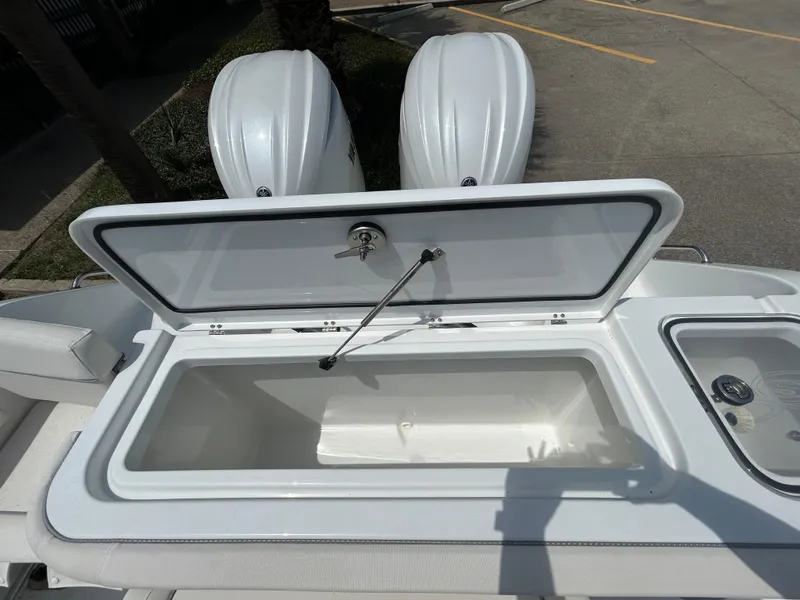 Slide: The Image of 2025 Sea Hunt Gamefish 27 with open coffin box, dual engines visible. - 6