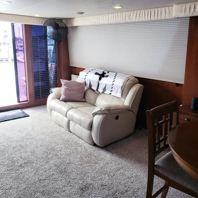 Slide: The Image of Interior of 1988 Viking 55 Motoryacht with cozy seating and elegant decor. - 30