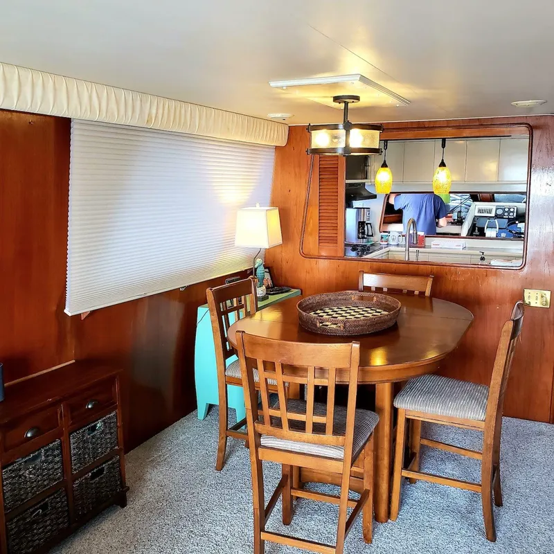 Slide: The Image of Interior of 1988 Viking 55 Motoryacht with dining area and kitchen view. - 37