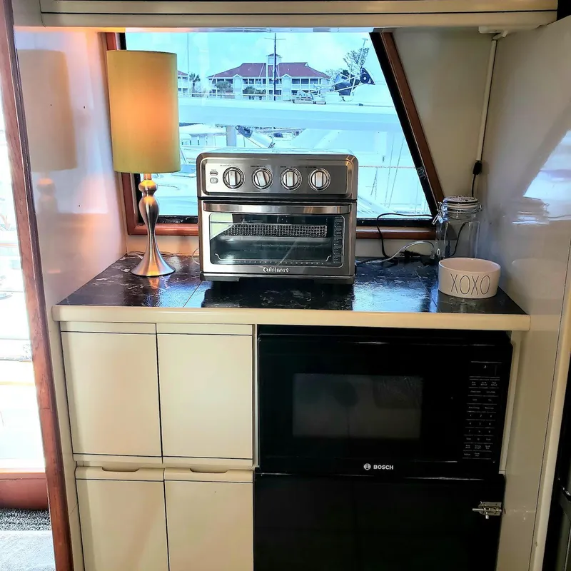 Slide: The Image of 1988 Viking 55 Motoryacht kitchen with toaster oven, lamp, and Bosch microwave. - 38