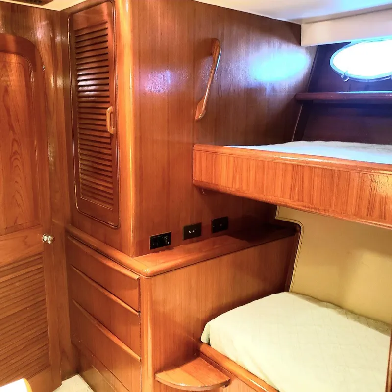 Slide: The Image of Wooden interior cabin with bunk beds on a 1988 Viking 55 Motoryacht Walkaround. - 49