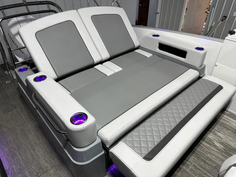 Slide: The Image of Luxurious seating on 2025 Godfrey AquaPatio 255 SFLW boat with LED cup holders. - 18