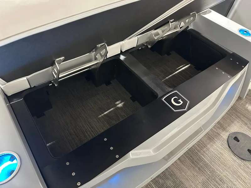 Slide: The Image of Open storage compartment in 2025 Godfrey AquaPatio 255 SFLW boat. - 19