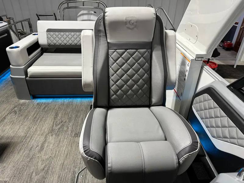 Slide: The Image of Luxurious seating on 2025 Godfrey AquaPatio 255 SFLW pontoon boat, featuring quilted upholstery. - 24