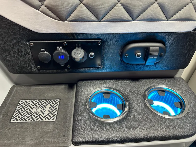 Slide: The Image of Interior of 2025 Godfrey AquaPatio 255 SFLW with illuminated cup holders and control panel. - 29