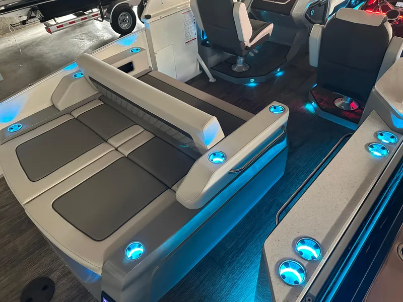 Slide: The Image of 2025 Godfrey AquaPatio 255 SFLW boat interior with illuminated seating and modern design. - 44