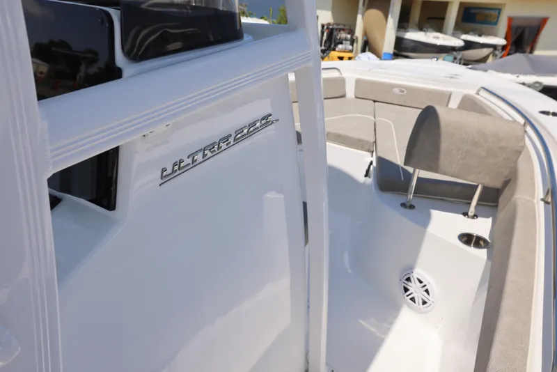 Slide: The Image of 2025 Sea Hunt Ultra 229 boat interior with seating and speaker detail. - 12