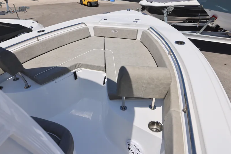 Slide: The Image of 2025 Sea Hunt Ultra 229 boat interior with cushioned seating and stainless steel accents. - 13