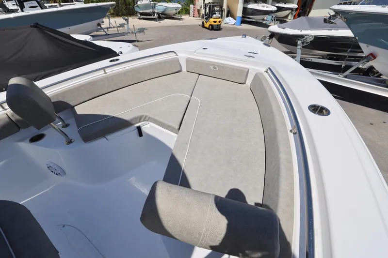 Slide: The Image of 2025 Sea Hunt Ultra 229 boat interior with cushioned seating and sleek design. - 2