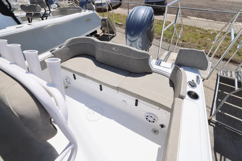 Slide: The Image of 2025 Sea Hunt Ultra 229 boat interior with seating and rod holders. - 7
